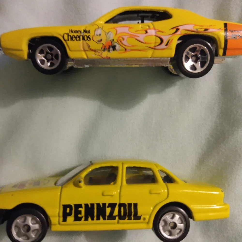 2002 Golden Wheel and 2004 Hot Wheels car